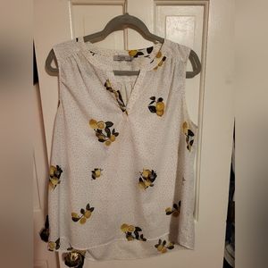 Dotted white top by Dalia with lemons on it